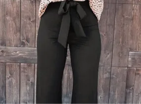 Black high waist front tie flared pants.